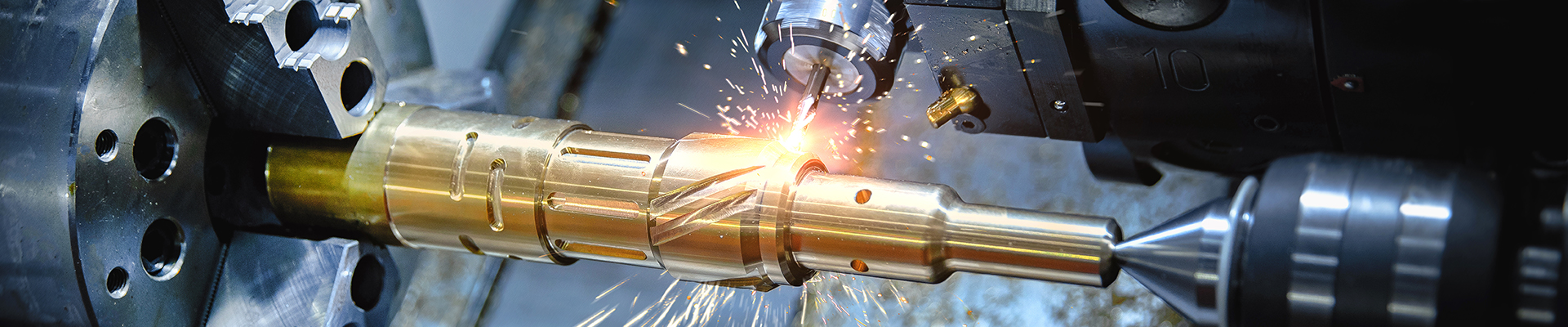 Close-up of precision metalworking, showcasing Beta\'s manufacturing capabilities.